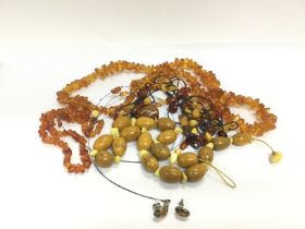 A collection of amber jewellery. Shipping category