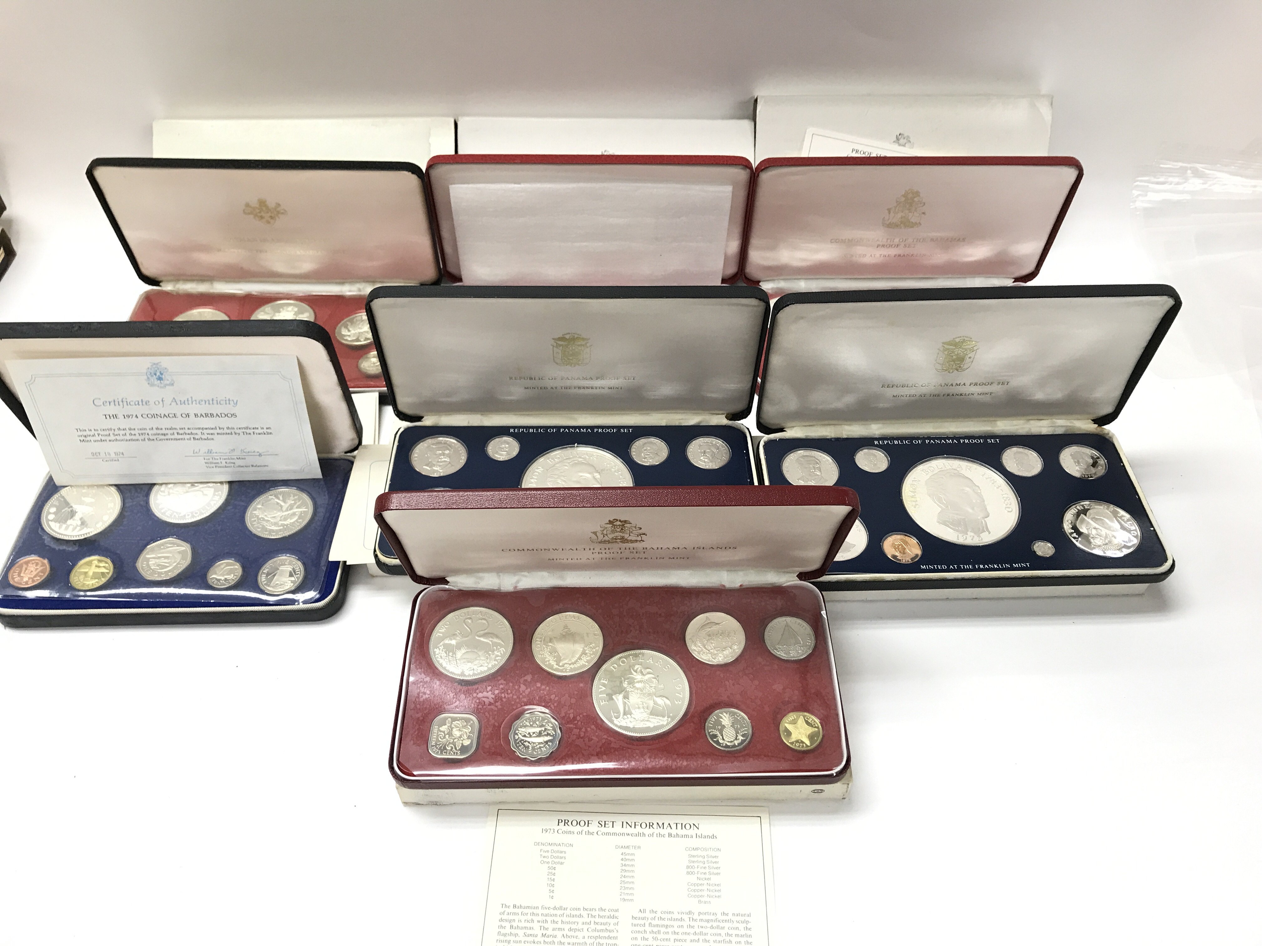 A collection of 7 proof coin sets including cayman