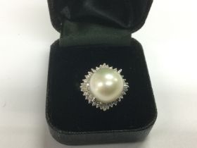 A platinum ring set with a white freshwater pearl