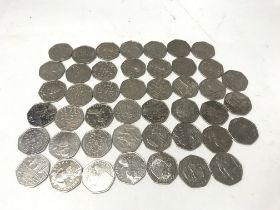 A collection of various design 50p coins including