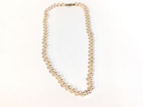 A string of cultured pearls with a 9ct gold clasp.