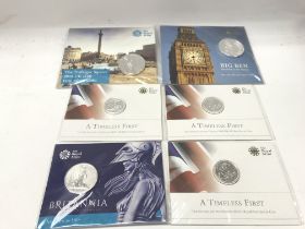 A collection of sealed fine silver coins including