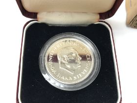 A Sierra Leone 10th anniversary coin with original