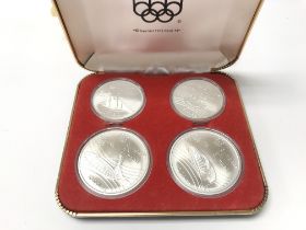 A 1976 Silver Olympic coin set. Postage A