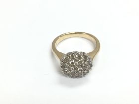 A 9ct gold diamond cluster ring, RBC diamonds appr