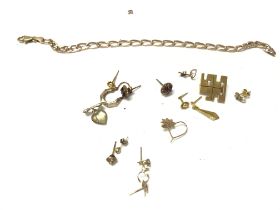 A Collection of assorted 9ct gold jewellery including earrings pin badge and bracelet. Approximately