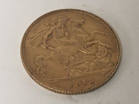 A 1913 gold half sovereign.