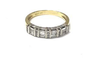 An 18ct gold ring set with 1/2 ct of baguette and