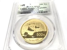 A 2014 1oz China Panda gold 500yn coin. PCGS grade