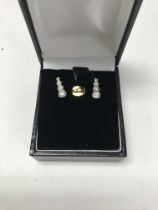 An 18ct white gold diamond set pair of earrings. A