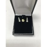 An 18ct white gold diamond set pair of earrings. A