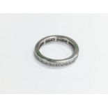 An 18ct white gold eternity ring, approx size K-L