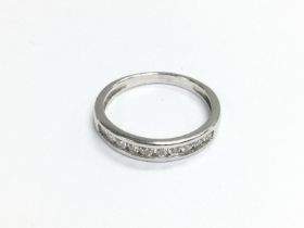 A 9ct white gold half eternity ring, approx size N