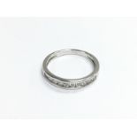 A 9ct white gold half eternity ring, approx size N