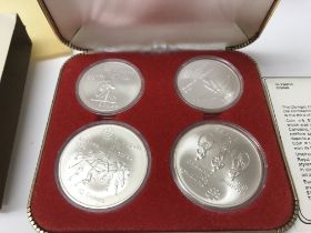 A 1976 Silver Olympic coin set. Postage A