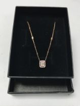 A 14ct rose gold necklace with diamond set square
