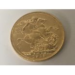 A Gold 1918 George V sovereign.