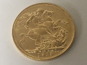 A Gold 1918 George V sovereign.