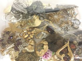 A collection of brooches. Postage category B