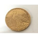 An American Gold Five dollar coin dated 1912.