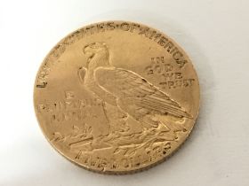 An American Gold Five dollar coin dated 1912.