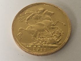 A 1911 George V gold sovereign.