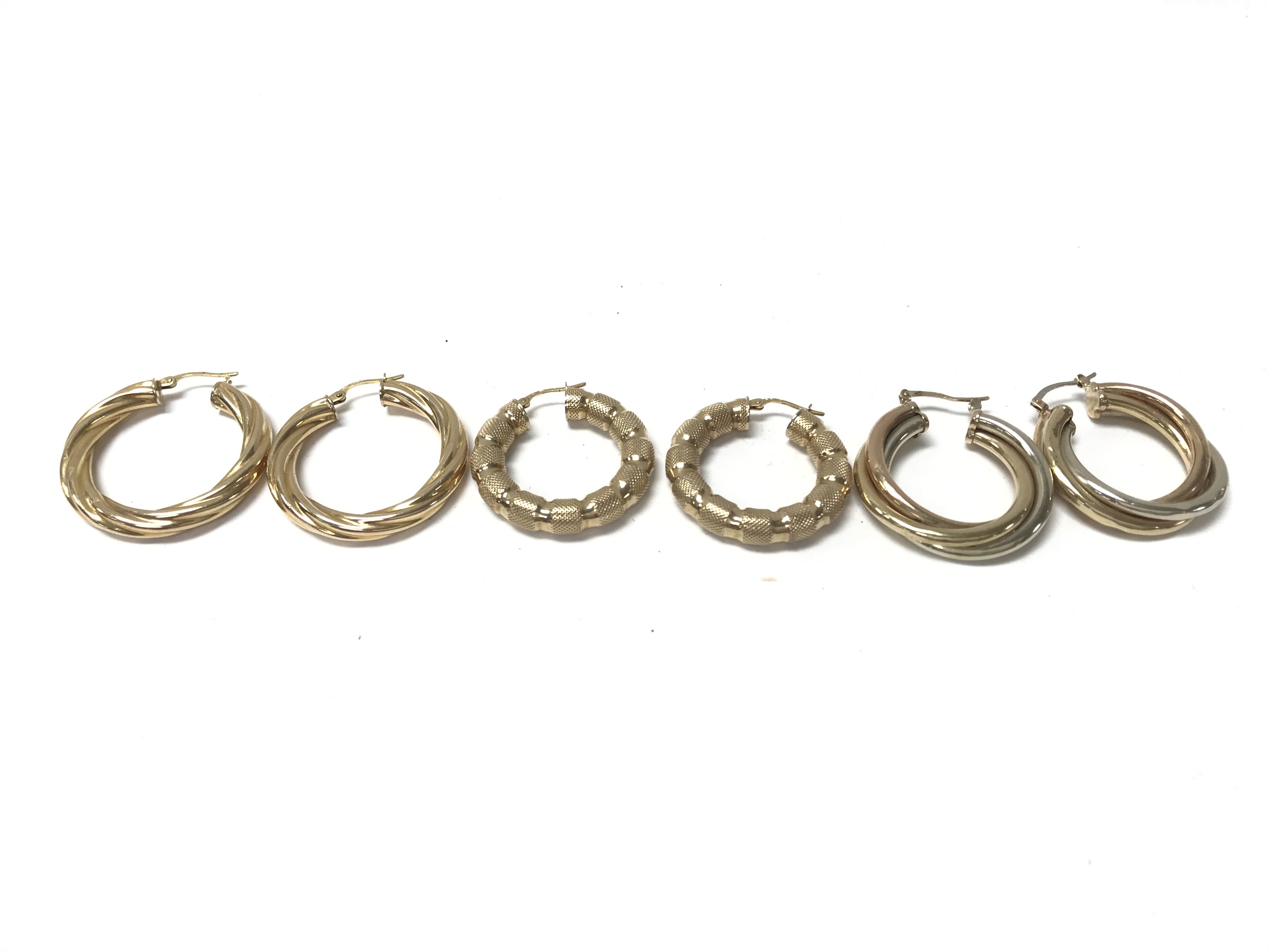 3 pairs of 9ct gold hoop earrings. Total weight 17