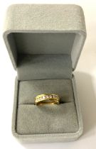 An 18ct gold and diamond set half eternity twist r