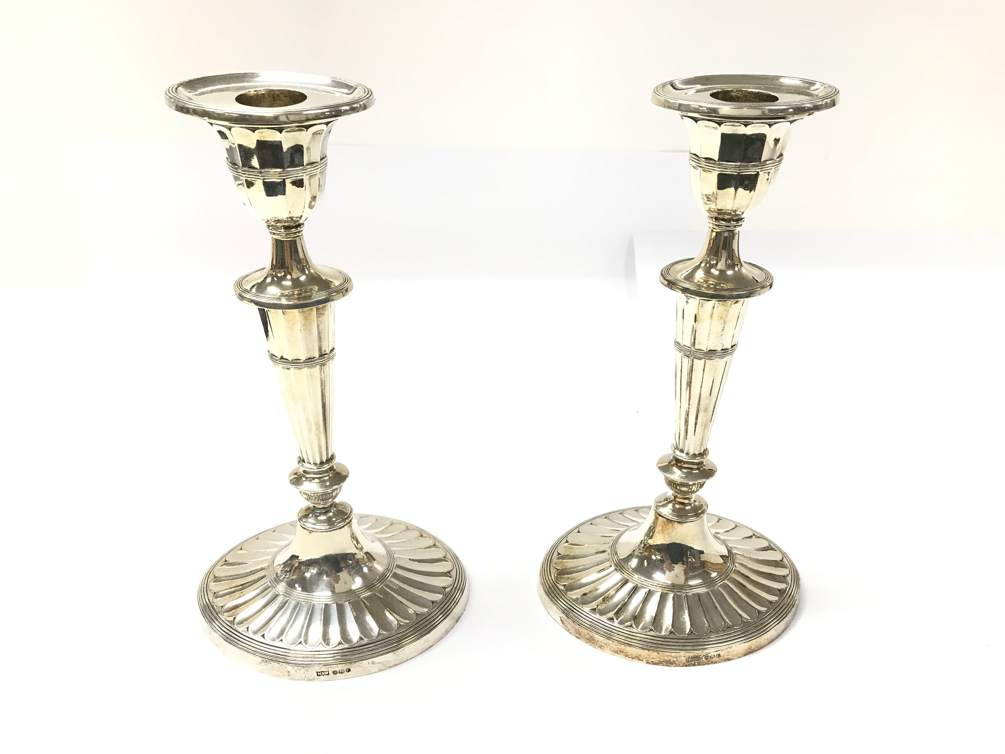 A pair of silver candlesticks by Mappin and Webb.