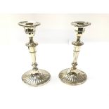 A pair of silver candlesticks by Mappin and Webb.