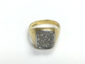 An 18ct gold ring with ten pave set diamonds, appr