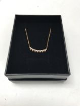 A 14ct rose gold diamond set necklace. Approx weig