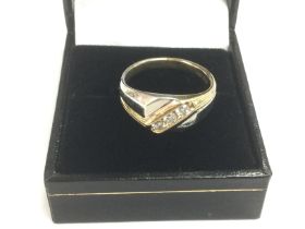 A 9ct yellow and white gold ring diagonally channe