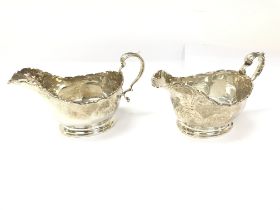 A pair of silver sauce boats with Birmingham hallmarks from 1931/1932 280g. Postage B