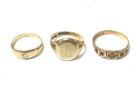 Three gents gold rings of 14ct and 15ct. Total wei