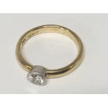 An 18carat yellow gold solitaire diamond ring set