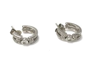 Platinum and diamond hoop earrings. 8.6g