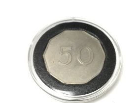 A rare test piece for a ten sided British fifty pe