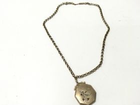 A 9ct gold chain with a gold front and back locket
