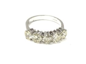 An 18ct white gold ring set with five faint yellow