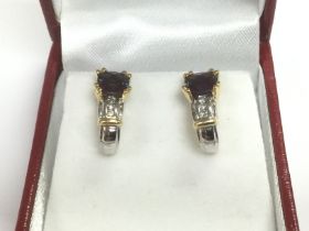 A certificated pair of 18ct and 14ct white and yel
