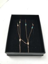 A 14ct rose gold necklace set with diamond and ena