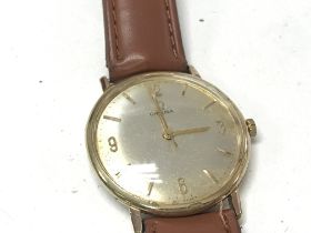 An Omega Gold Plated manual wind wrist watch. Silv