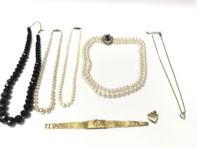 A mixed collection of necklaces and other items in