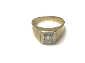 A 9ct gold diamond set gents signet ring. Approx 0