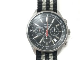 A Seiko Chronograph wrist watch on a NATO strap. C