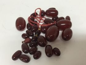 A collection of graduating red amber or Bakelite b