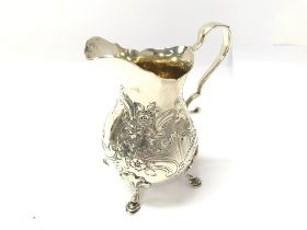 A silver cream jug with London 1908 hallmarks. 241g and 12.5cm tall.