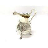 A silver cream jug with London 1908 hallmarks. 241g and 12.5cm tall.