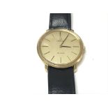 An omega DeVille gold plated wrist watch with gold